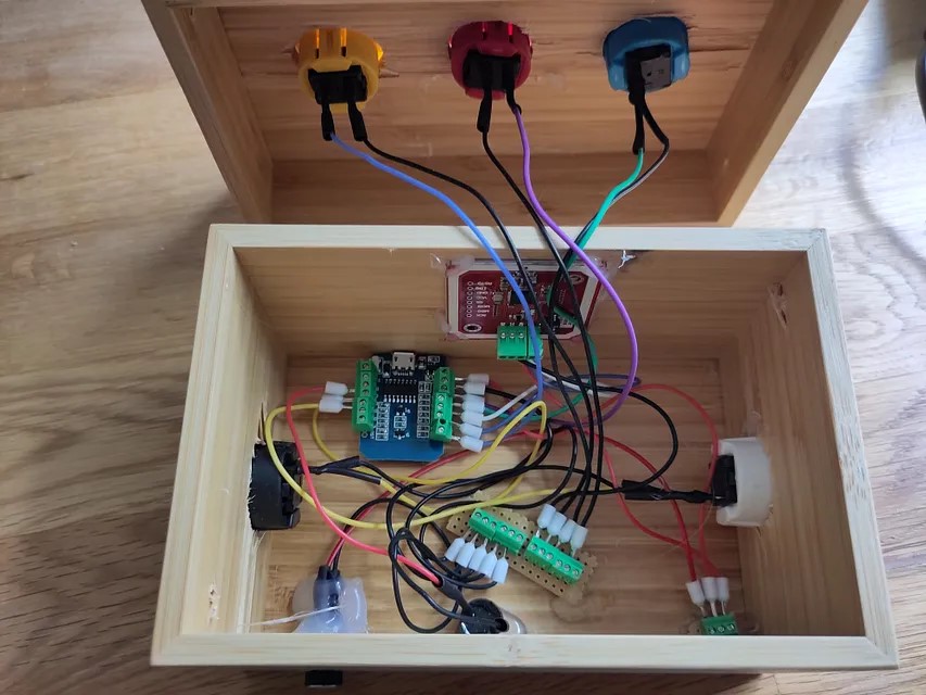 All inner components of the DIY music box attached and glued to the box